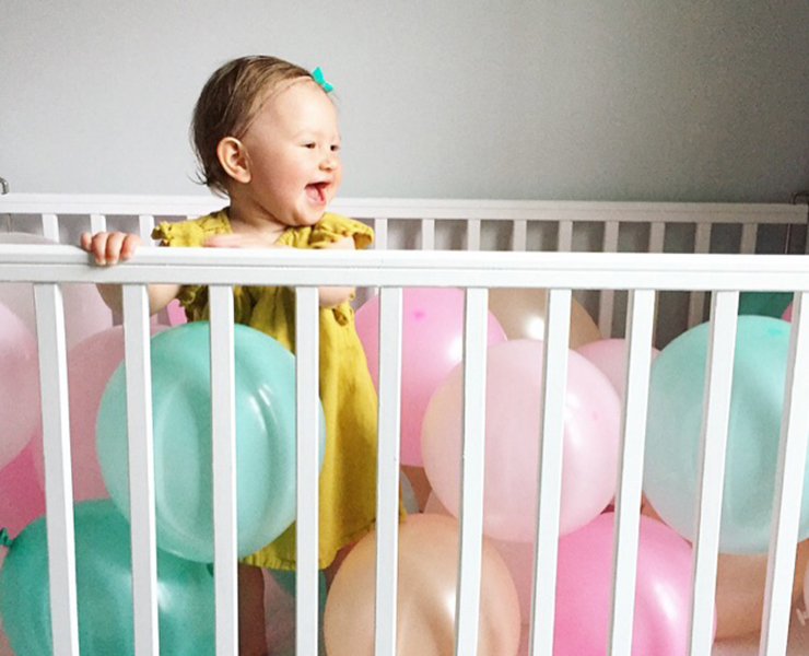 baby with red ballons