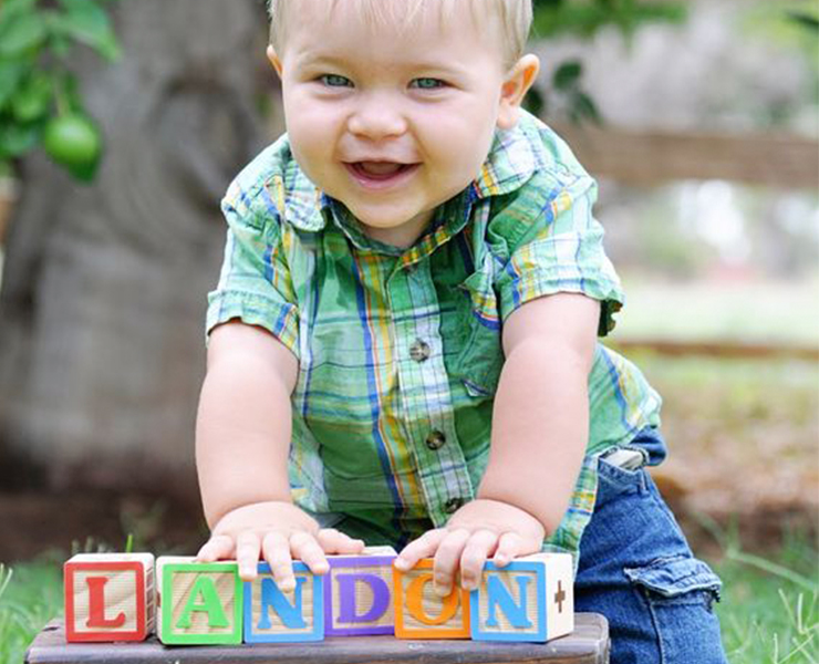 baby with name blocks