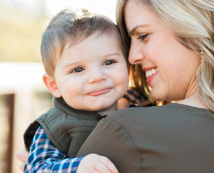 smiling baby with mom
