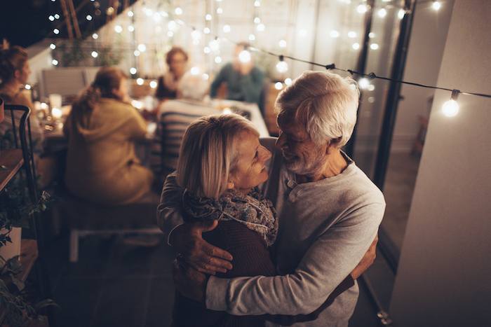 A couple dances at a retirement party