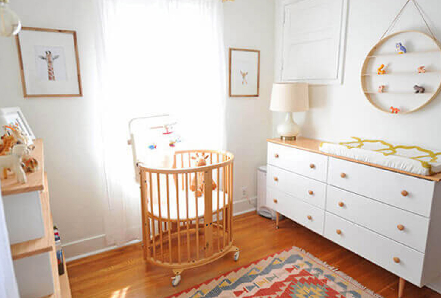 Center crib in baby nursery.