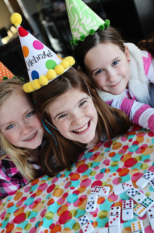 smiling kids in party hats