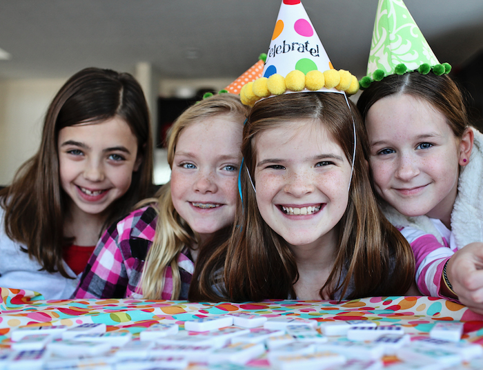 smiling birthday girls in hats