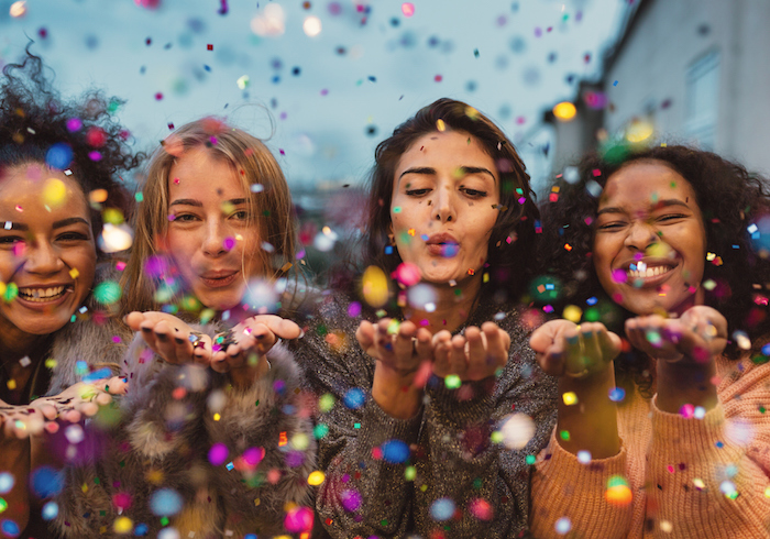 girls blowing sparkles