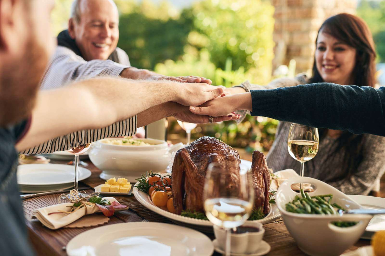 a family celebrates thanksgiving with family traditions