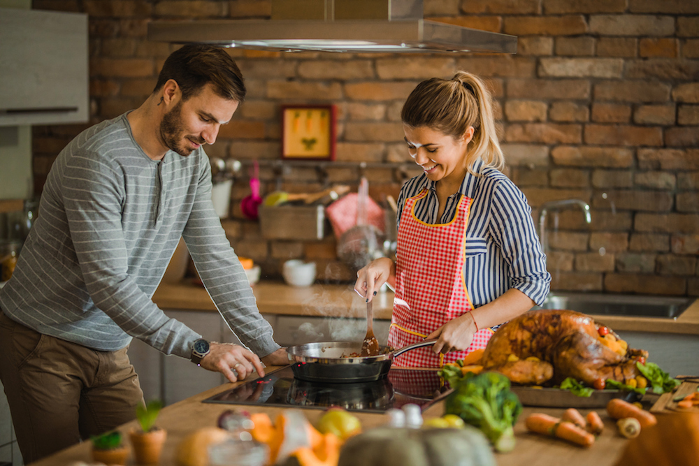 Two friends celebrate Friendsgiving by preparing dinner