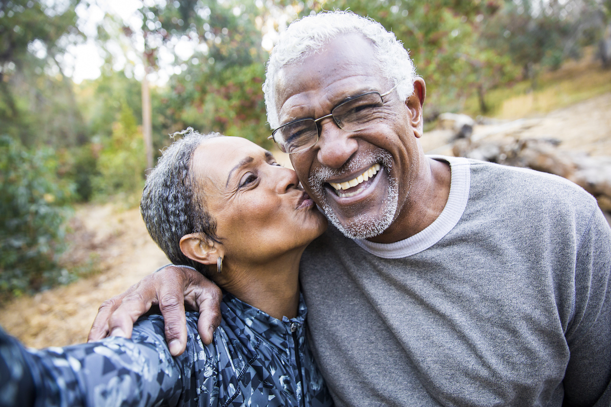 Senior Couple Taking Selfie During Retirement party