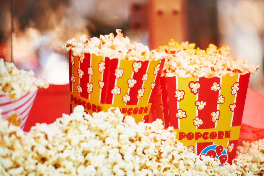 Cropped view of freshly popped corn in packages