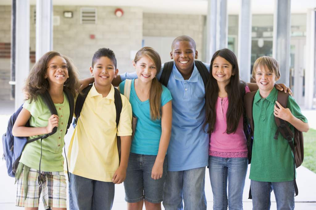 Elementary school class standing outside for a school picture day