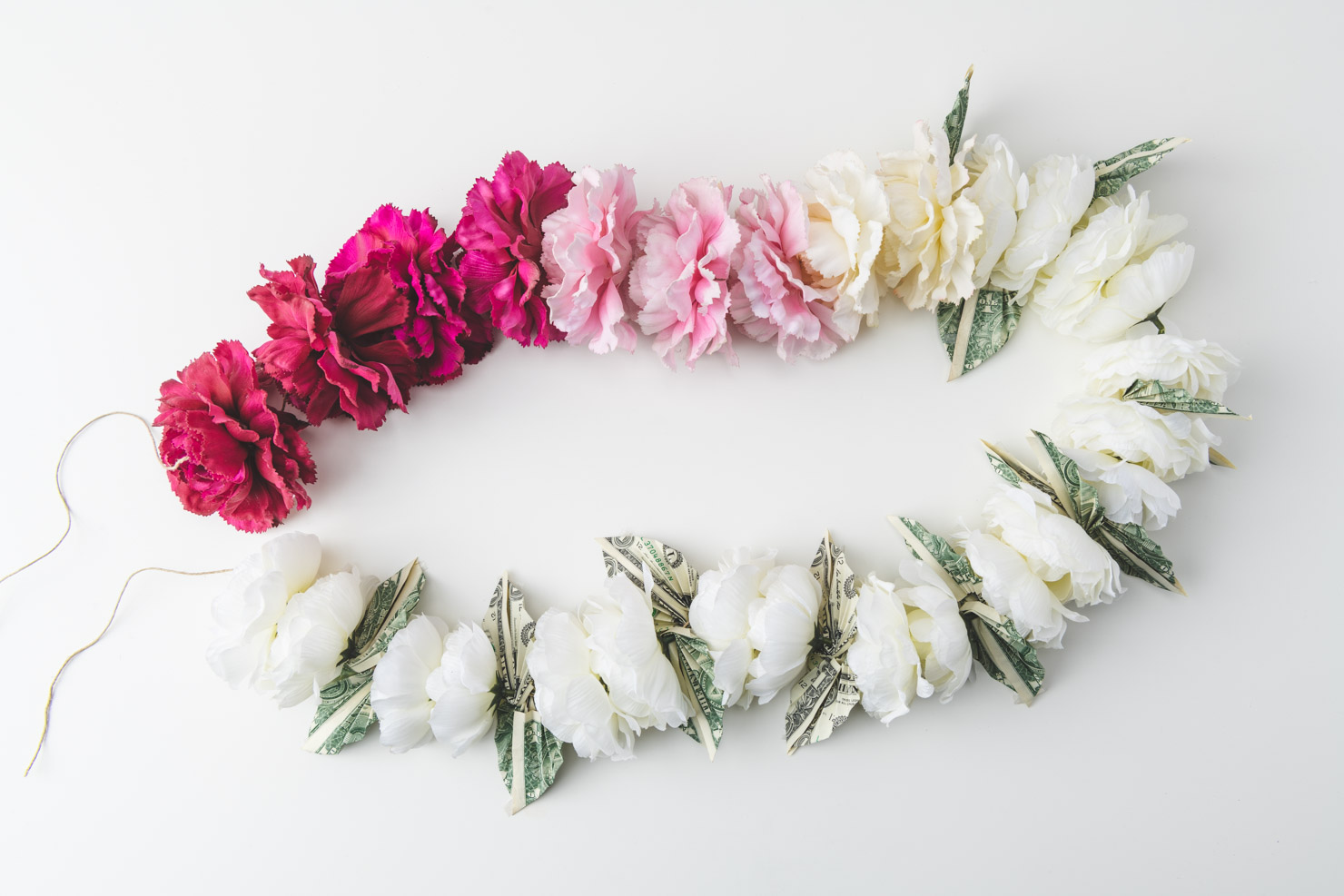 a lei with dollar bills all around
