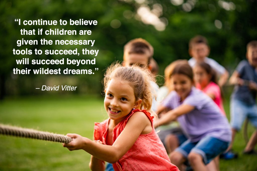 Happy kids pulling a rope in park with children quotes overlay