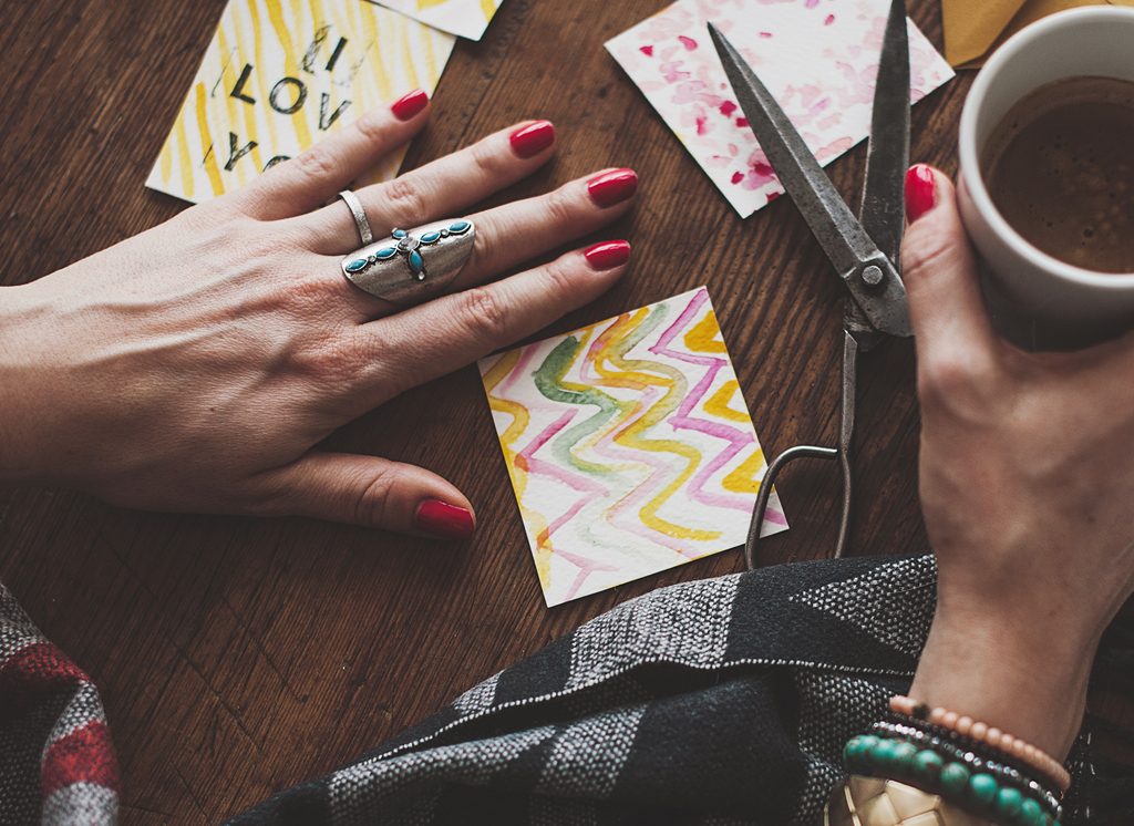 Woman making water color card.