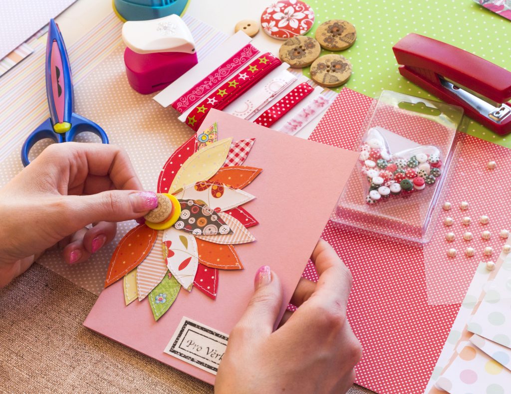 Woman making a scrapbooking birthday card.