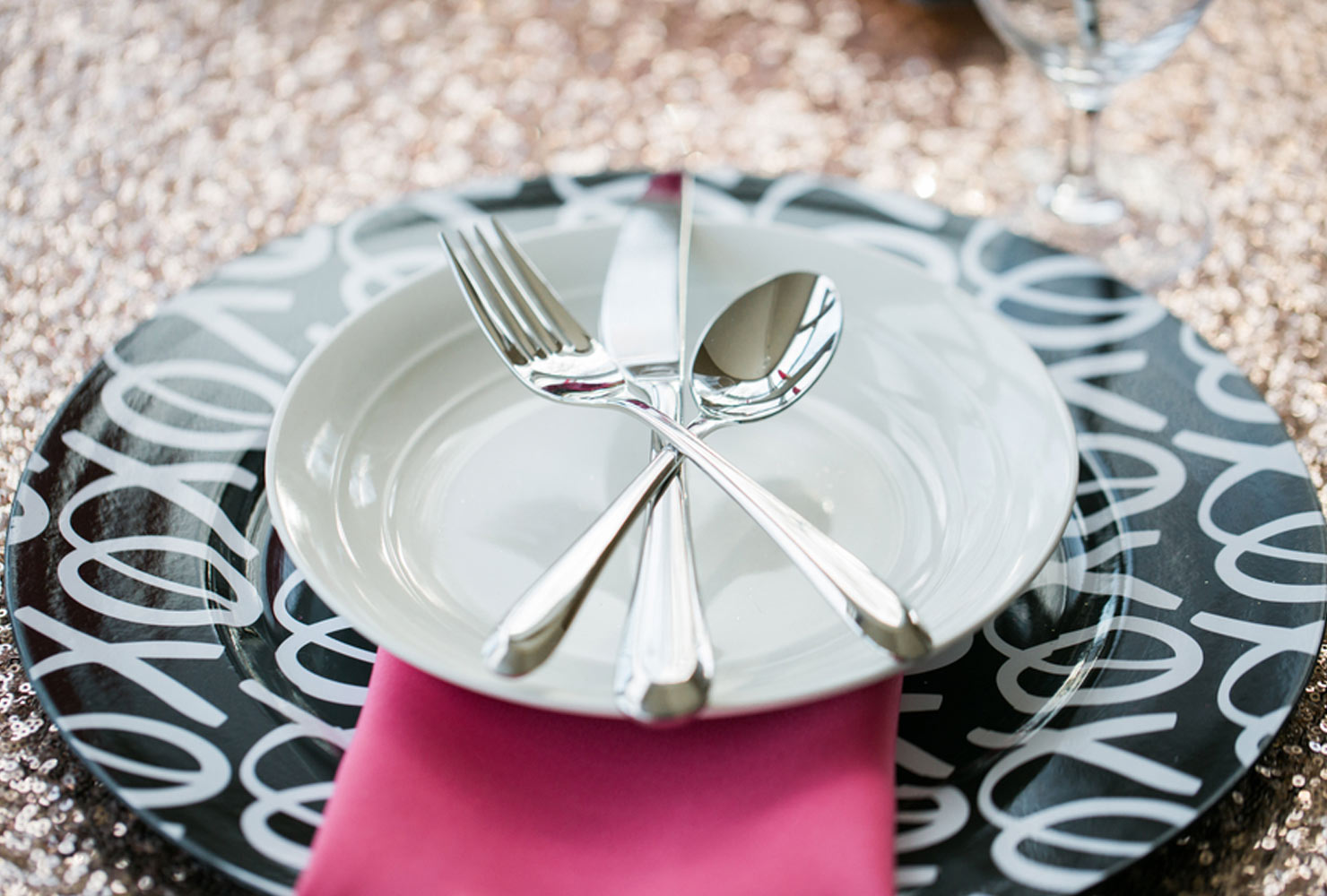 pink and black wedding dinner is served