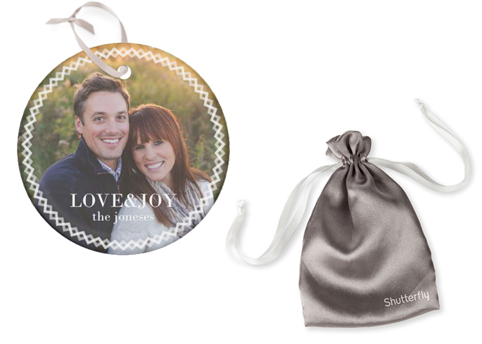 A glass photo ornament and Shutterfly silk bag.