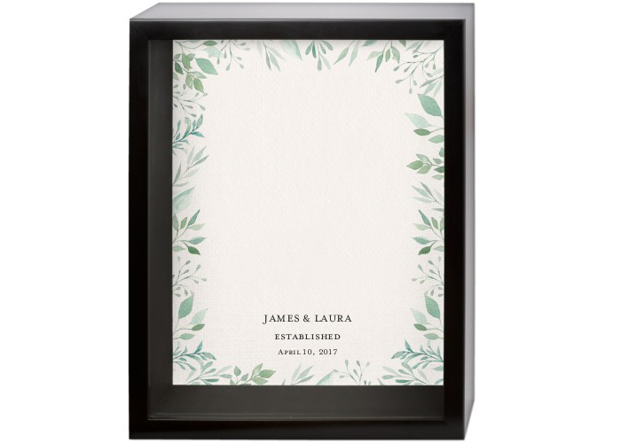 An empty shadow box with a wedding theme.