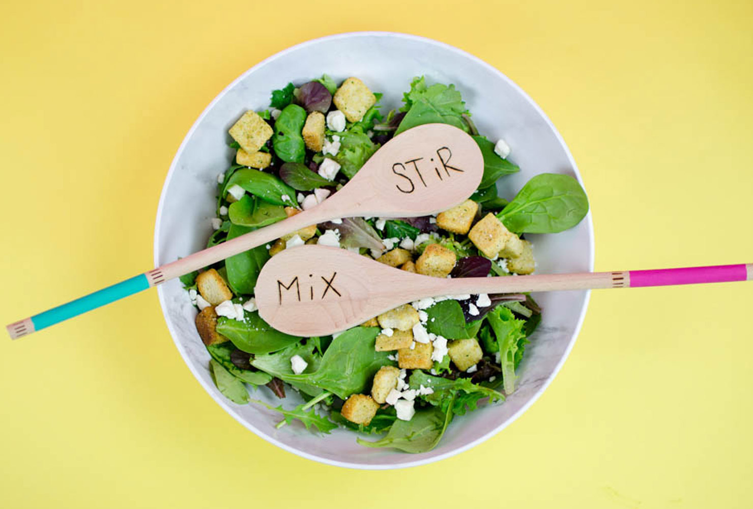 Salad bowl with wooden spoons.