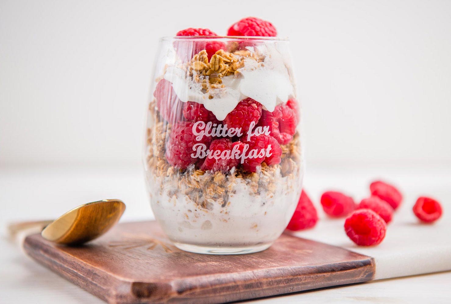 Yogurt and granola in stemless glass.