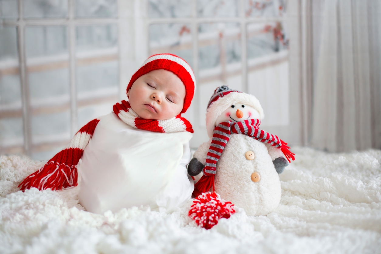 Christmas portrait of cute little newborn baby boy, wearing santa hat