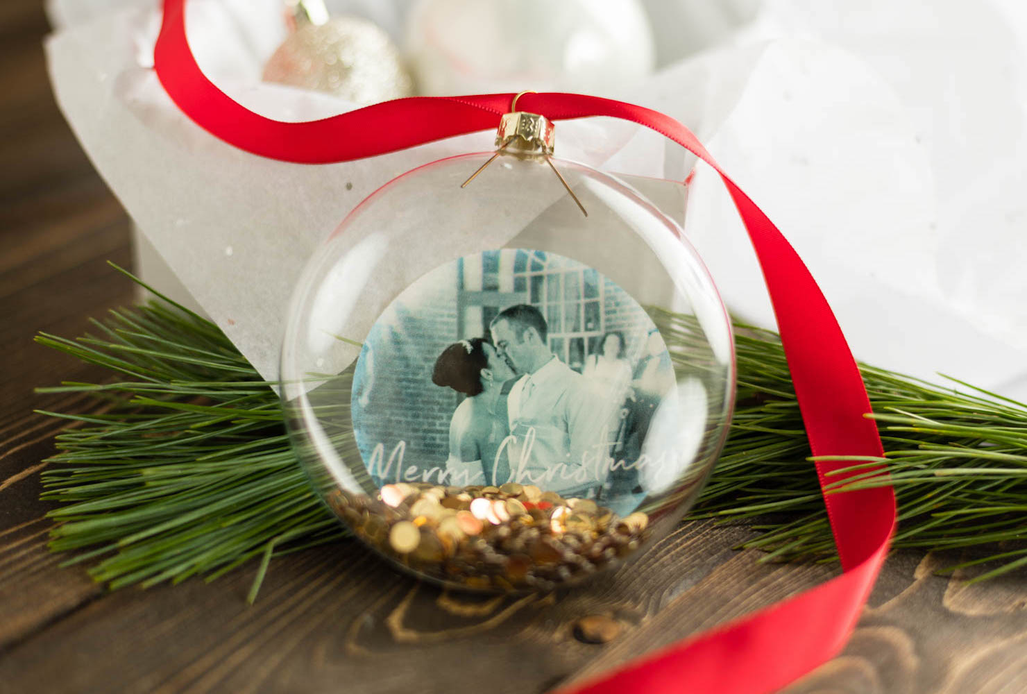 Orb ornament with red ribbon.