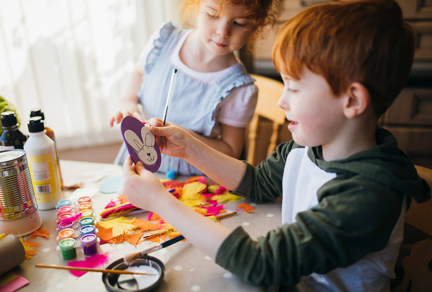 Boy and girl making crafts.