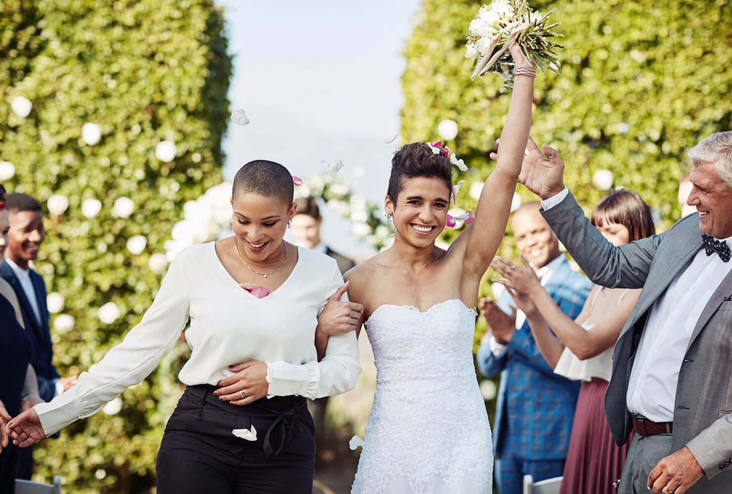 Recently married couple walking down the aisle.
