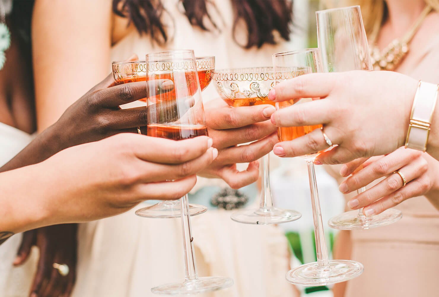 Closeup of bridal party making a toast.