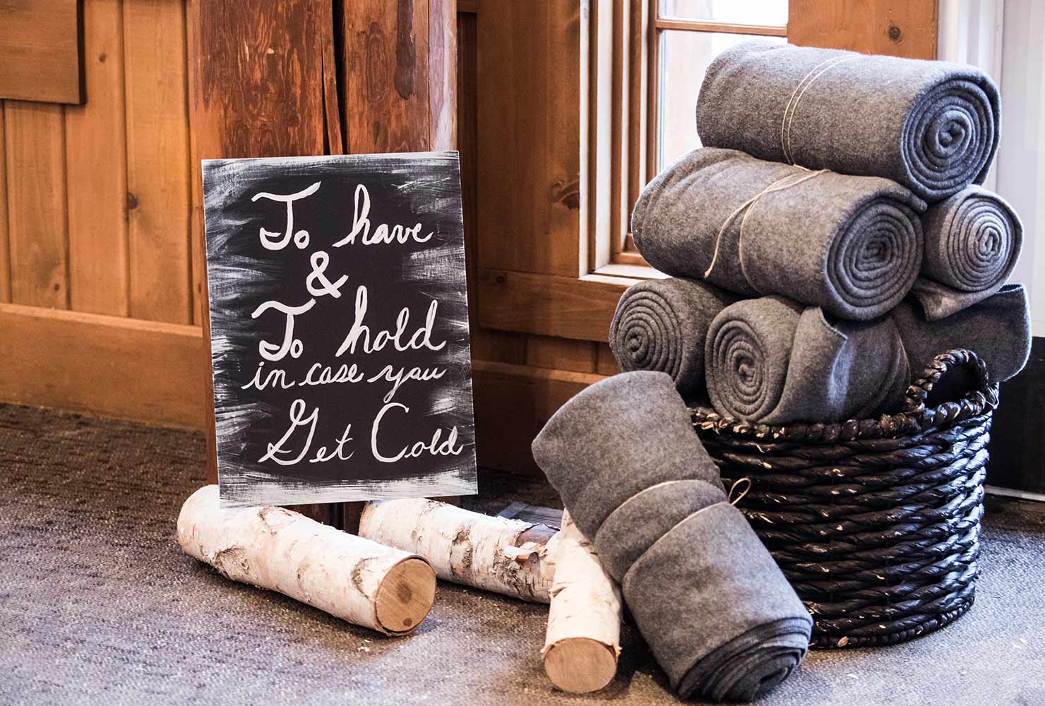 Basket of rolled blankets.