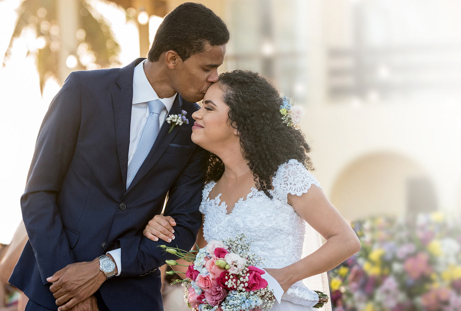 Groom kissing bride on wedding day
