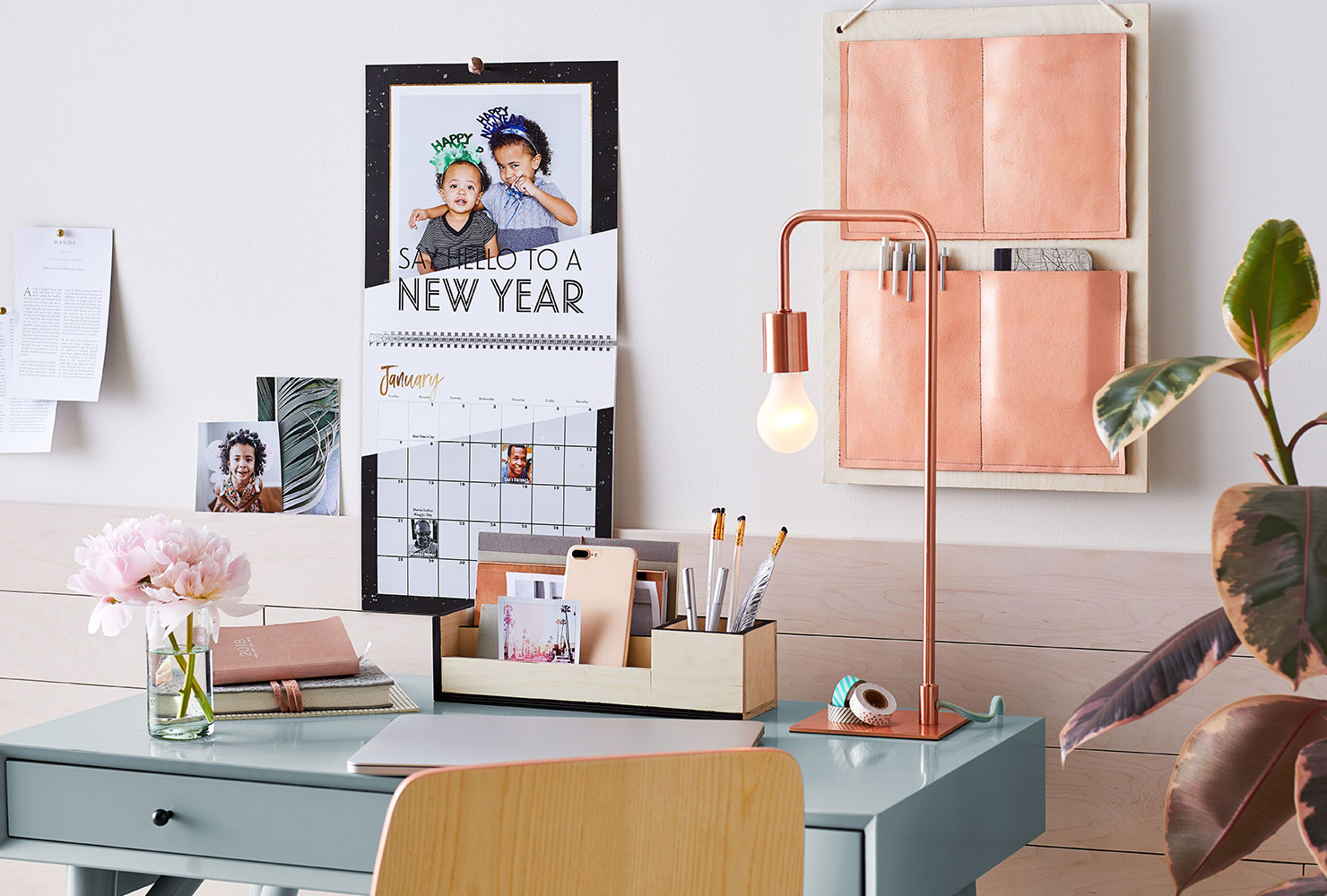 Wall calendar hanging over desk.