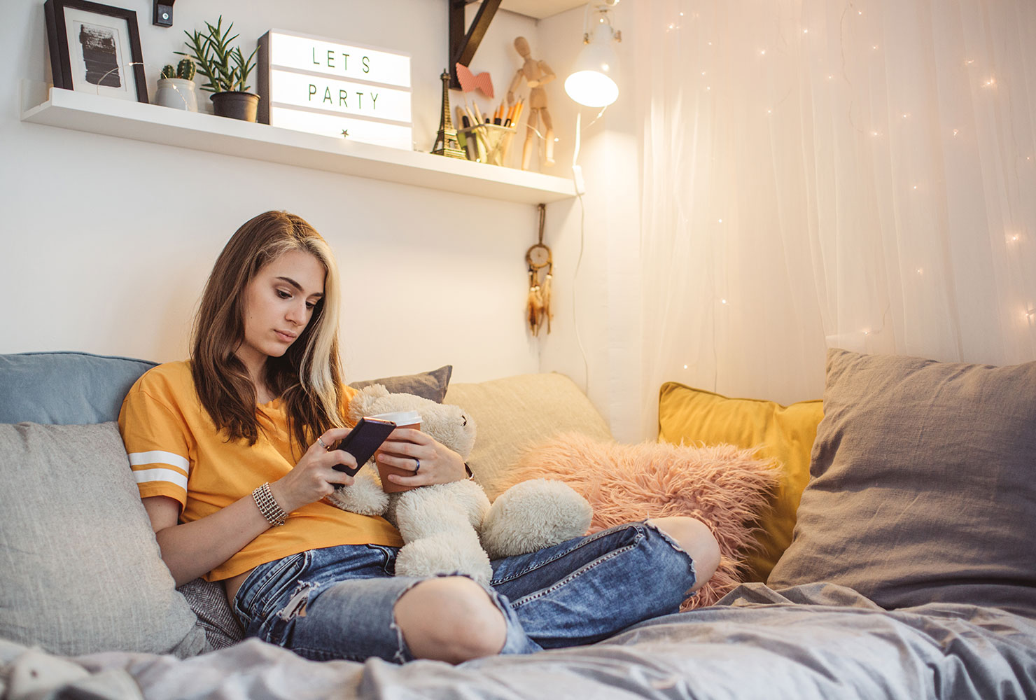 Girl sitting in dorm room. 