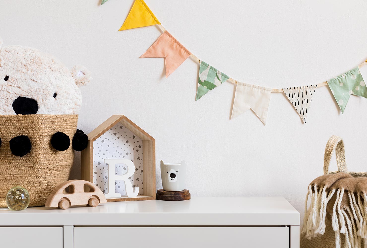 Pastel garland in baby room.