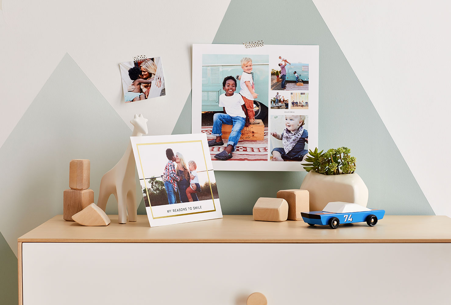 Family pictures hanging in baby nursery.