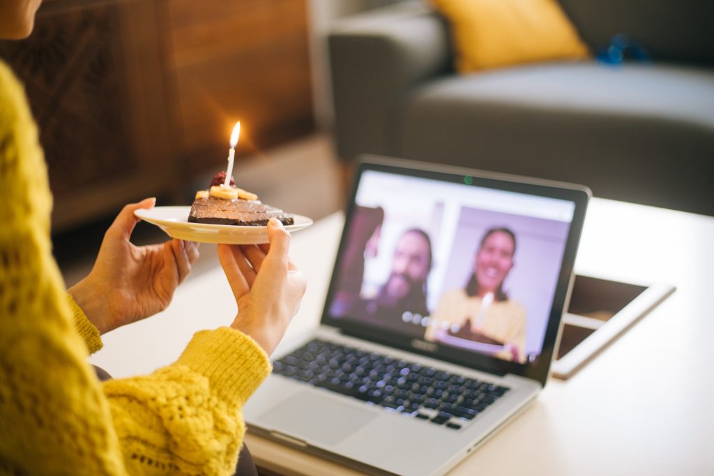 Woman celebrating birthday with video conference