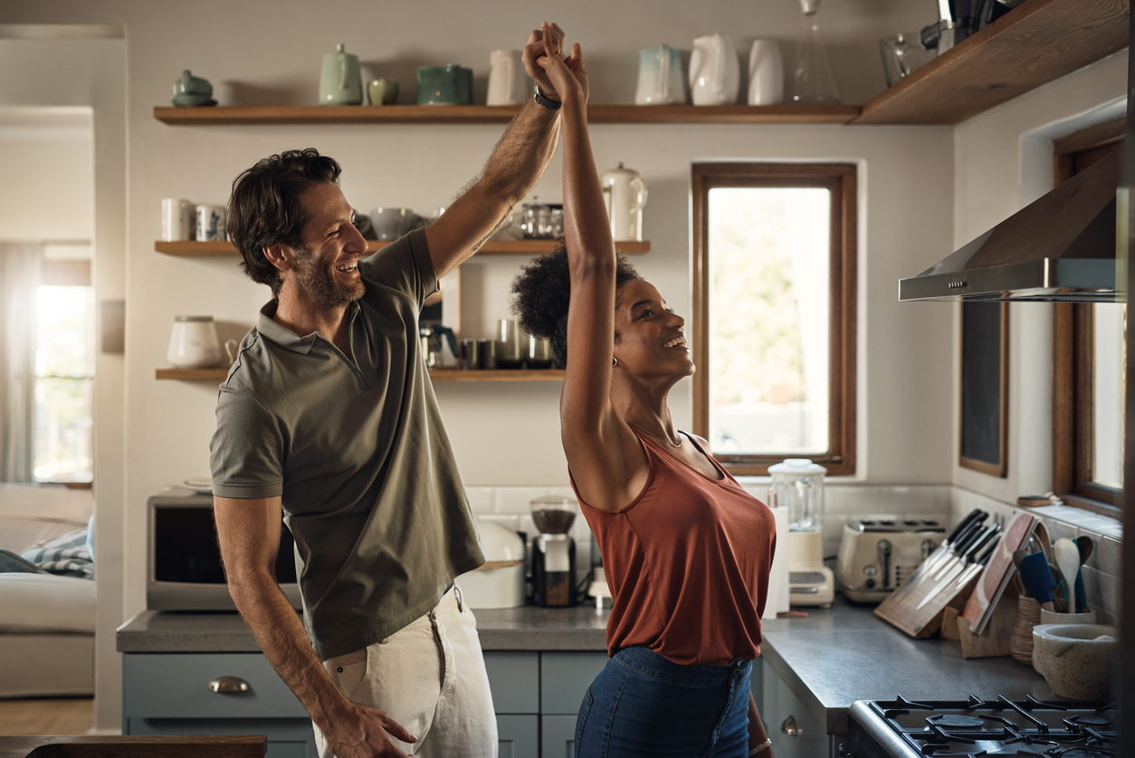 couple dancing in the kitchen