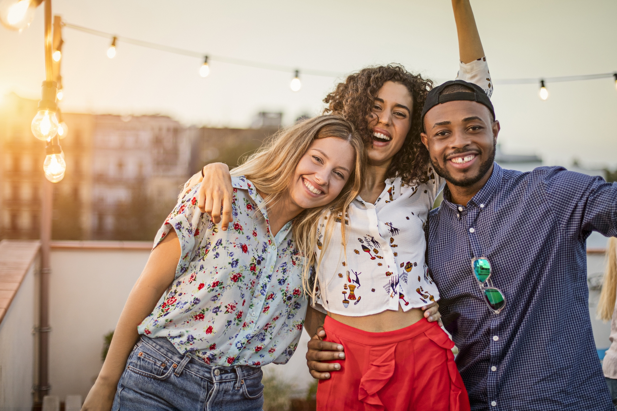 group of friends smiling outdoors